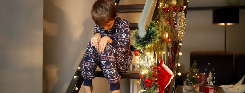 Lonely boy in pajamas fighting off meltdown on New Years Eve.